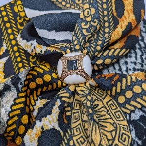 Gold tone white and black costume ring